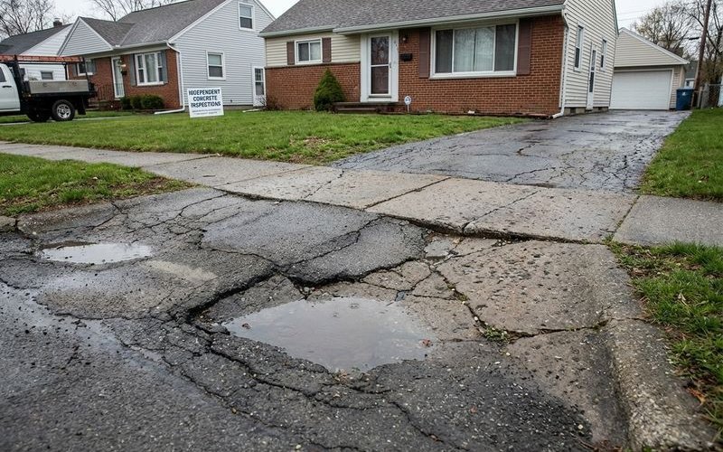 Diagram showing poor soil compaction during construction causing later settling